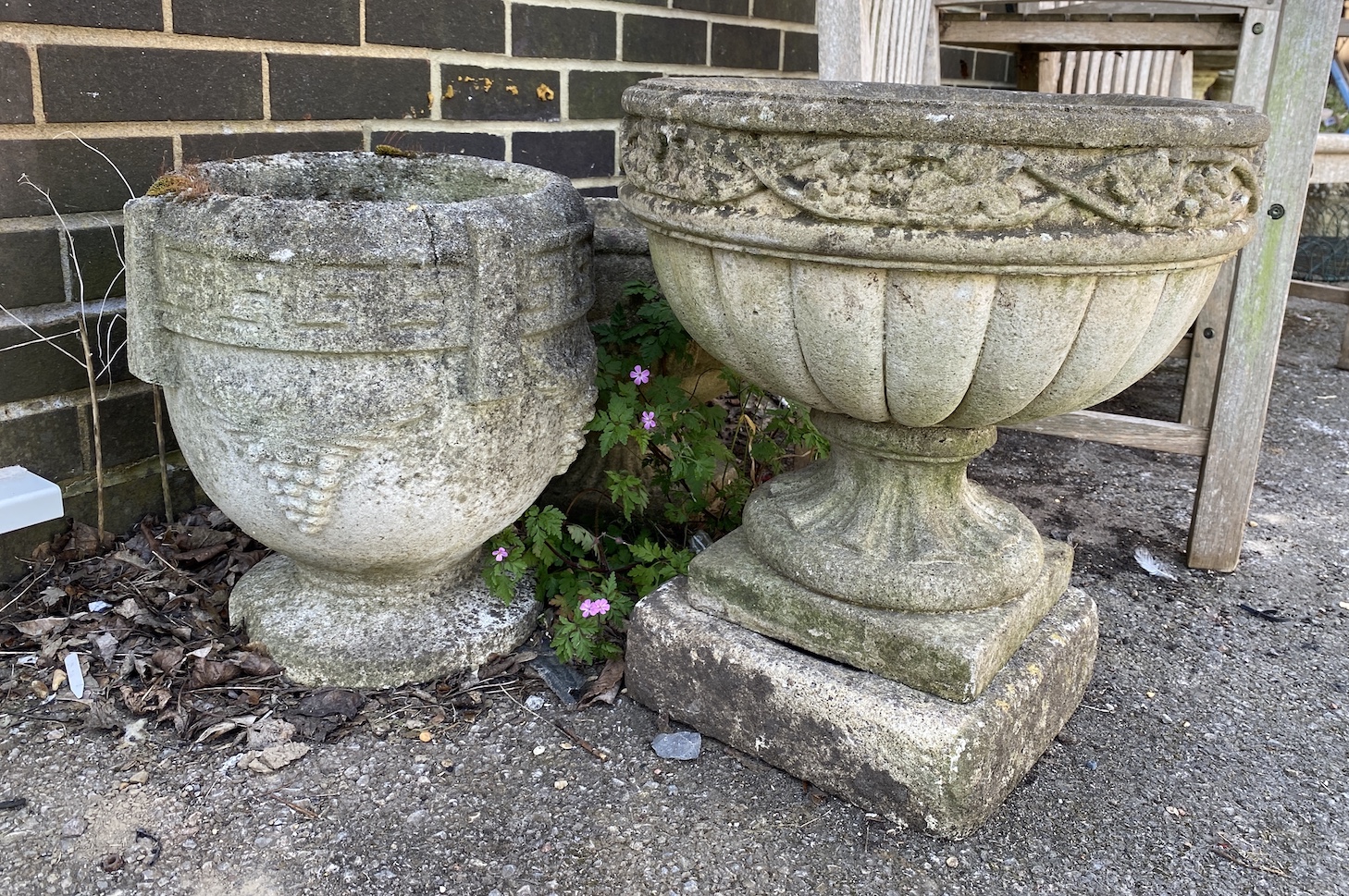Three circular reconstituted stone garden planters, largest diameter 46cm, height 49cm *Please note the sale commences at 9am.